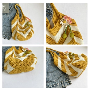 Detail of hand-woven yellow and white chevron knit tote bag with flower charm