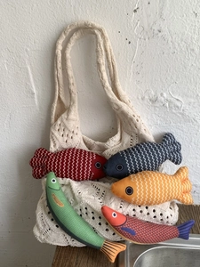Knit patchwork tote bag with colorful fish-shaped fabric pouches in various bright colors