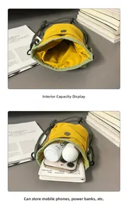 Detailed interior view of a canvas crossbody bag showing capacity for a phone and notepad