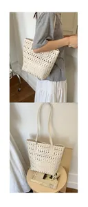 Detail view of cream laser-cut tote bag featuring geometric patterns and wavy edges