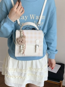 Fashionable checkered mini backpack in white and beige with a cute plush bear charm