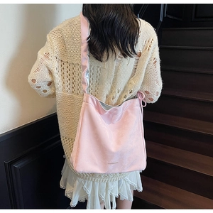 Rear view of a model wearing a soft pink tote bag with Fashion & Bags print