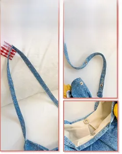 Détail de la boucle métallique et de la fermeture magnétique du sac en jean bleu