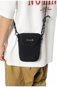 Detail of black nylon crossbody phone bag with braided rope strap and brand logo