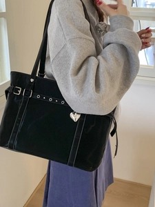 Y2K style black tote bag with silver metal eyelets and heart charm for commuting