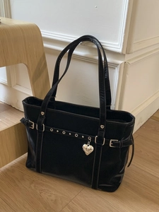 Y2K style black faux leather tote bag with silver heart charms and metal eyelets