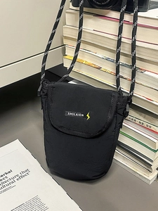 Minimalist black nylon crossbody phone bag with yellow lightning logo and rope strap