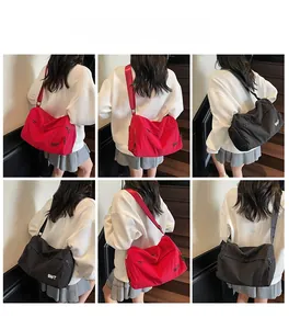 Multi-angle view of large nylon crossbody bag in red and black with BNT logo detail