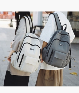 Detail view of the multi-pocket structure and high-density fabric on the casual backpack
