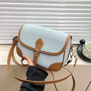 Blue and brown minimalist square saddle bag with adjustable shoulder strap and litchi grain