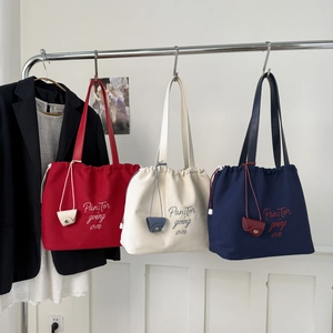 Large letter canvas tote bags in red, beige and navy blue with embroidery and drawstring