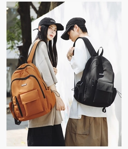 Dual view of black and tan large nylon travel backpacks for men and women on models