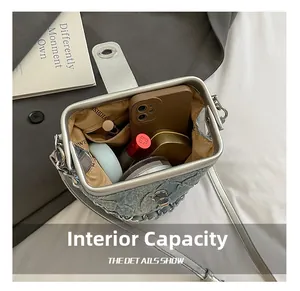 Top view of denim bucket bag interior showing capacity for phone and cosmetics