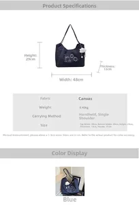 Detail view of denim tote bag with letter embroidery and white cloud plush charm