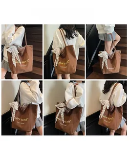 Brown canvas tote bag with lace bow detail shown on a model from multiple angles