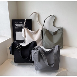 Nylon tote bags in white, olive, black and grey colors with matching mini pouches