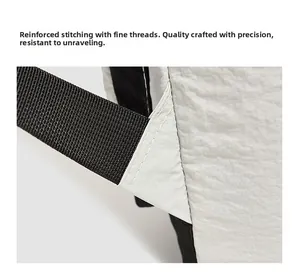 Detail of reinforced triangle stitching and high-density seams on the backpack strap