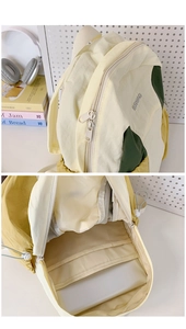 Detail view of the interior laptop compartment and metal zipper on the nylon backpack