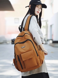 Brown large capacity casual backpack with multi-pocket design for outdoor travel