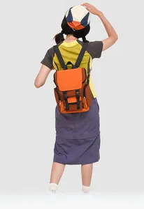 Detail of a color-block commuter backpack with orange and brown durable nylon fabric