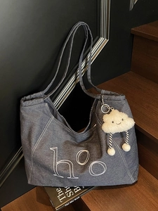 Vintage dark blue denim tote bag with white embroidery and plush cloud keychain
