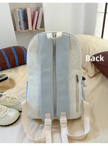 Detailed back view of star print backpack showing padded straps and hidden zipper