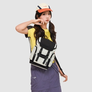 Outdoor leisure backpack in grey and black colorblock with buckle detail on a model