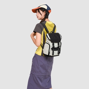 Side view of outdoor casual backpack featuring ivory fabric and black buckle detail