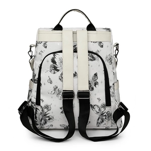 Detail view of the butterfly print backpack with back anti-theft zipper and PU straps