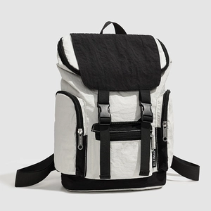 Detail of color-blocked backpack with adjustable buckles and side zipper pockets
