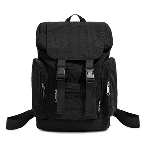 Detail showing the crinkled texture and waterproof nylon fabric of this black backpack
