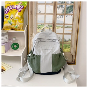 Detail of grey and olive green backpack with drawstring side pocket and ROYBAO logo