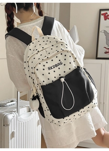 Close-up of stylish star pattern backpack with RKDBAG logo and zipper detail
