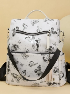 Modern white backpack with butterfly print featuring tassel detail and woven straps