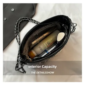 Quilted bucket bag interior showing spacious lining with phone and cosmetics storage