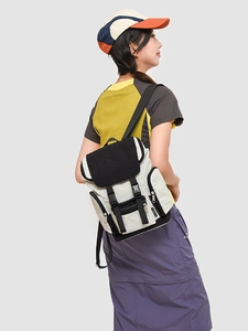 Modern outdoor style color-block backpack with buckle closure and multiple zipper pockets