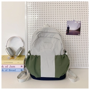 Detail of color-block nylon backpack with RGYBAO logo and drawstring side pockets
