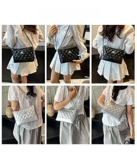 Detail view of black and silver quilted chain bags with star charms worn by a model