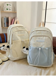 Detail view of large capacity school backpacks with star patterns and panda plush charm