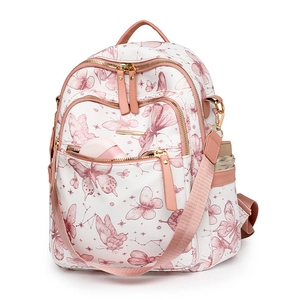 Gros plan du sac à dos blanc avec imprimé papillon rose et poche latérale avec parapluie