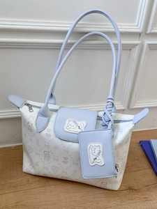 Light blue printed tote bag with cat motifs and a small zipper pouch for women