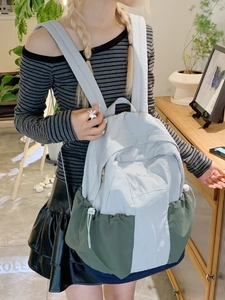 Minimalist color-block backpack in grey and olive green for travel and casual daily use