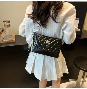 Quilted black chain bag with sparkling rhinestones and a silver dolphin charm accessory