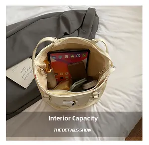 Top view showing large interior capacity of floral tote bag with tablet and cosmetics