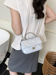 Light blue quilted crossbody bag with pearl finish and silver chain strap for women