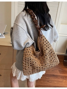 Large woven beach bag with brown ruffled shoulder strap for summer vacation