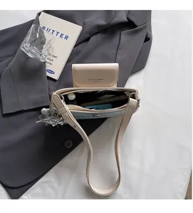 Internal view of beige PU leather shoulder bag showing capacity for daily essentials