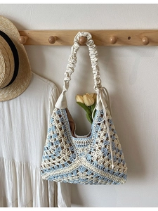 Blue and beige knitted shoulder bag with ruffled strap for summer beach holidays