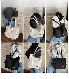 Detailed views of high-capacity canvas tote bag with round coin purse and leather patch