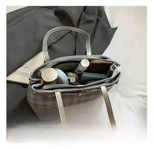 Silver checkered tote bag interior view showing large capacity for daily essentials